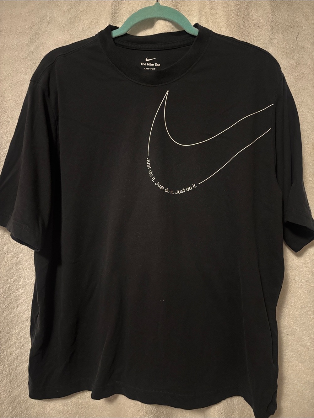 Nike Black Tee with Oversized White Swoosh Graphic